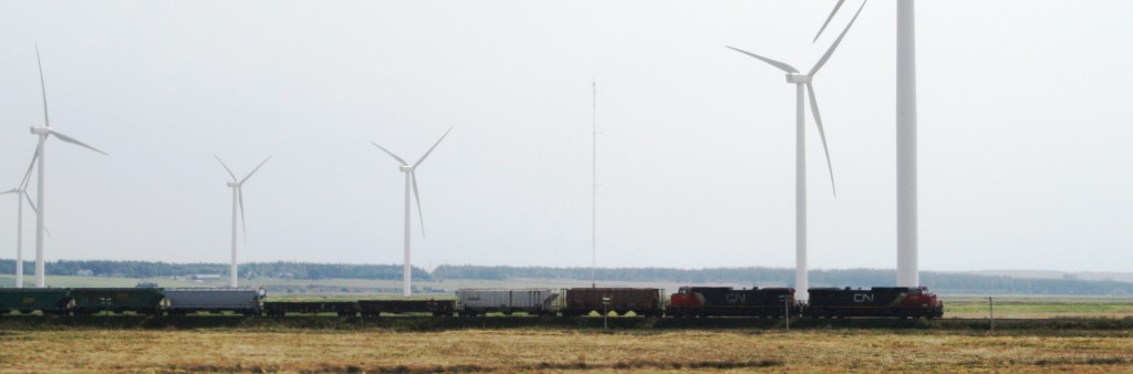 Wind turbines near Amherst, Nova Scotia, with train passing