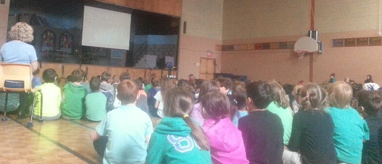 Elementary school kids at J. W. MacLeod, Halifax, laugh, hoot and awwww watching an environmental video for Earth Day 2017.